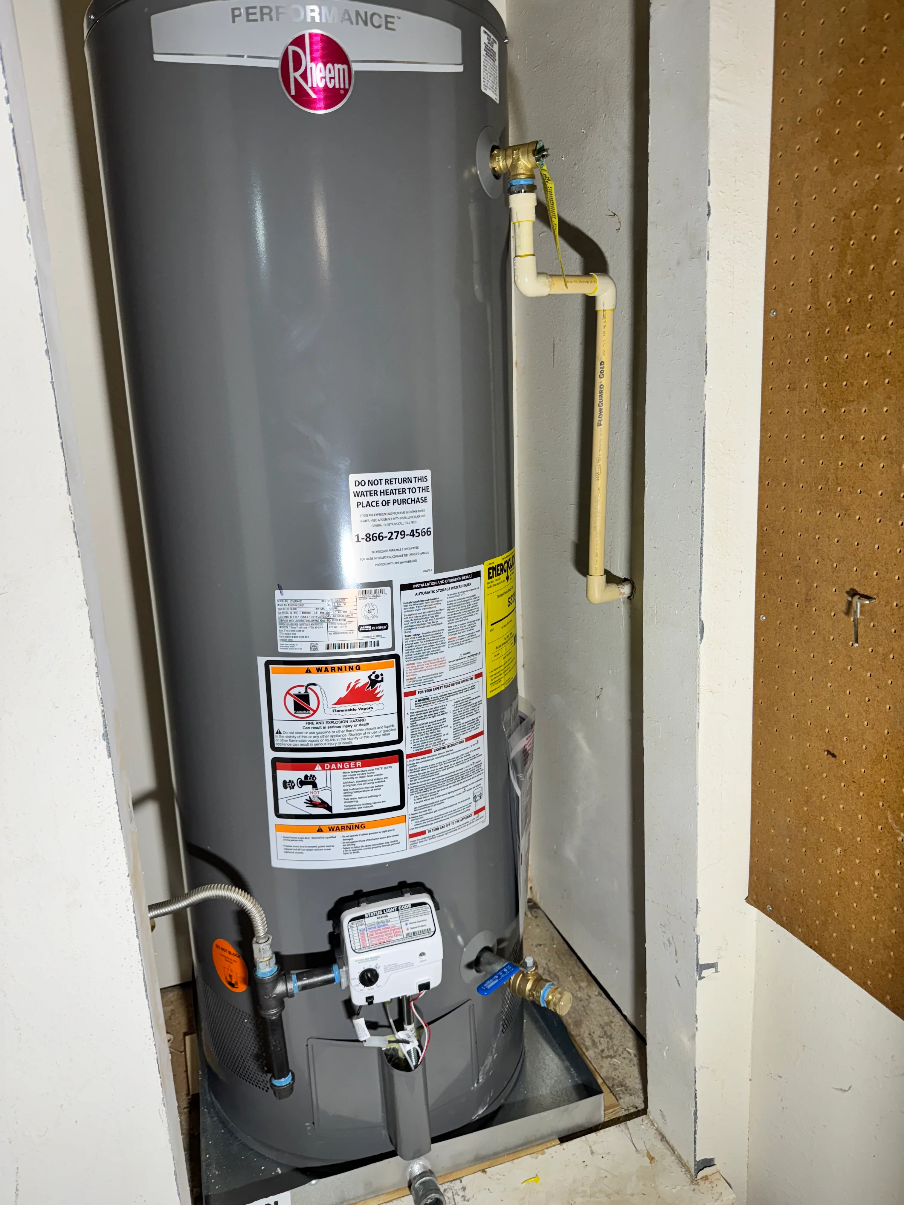 Rheem Performance water heater installation with brass fittings and relief valve
