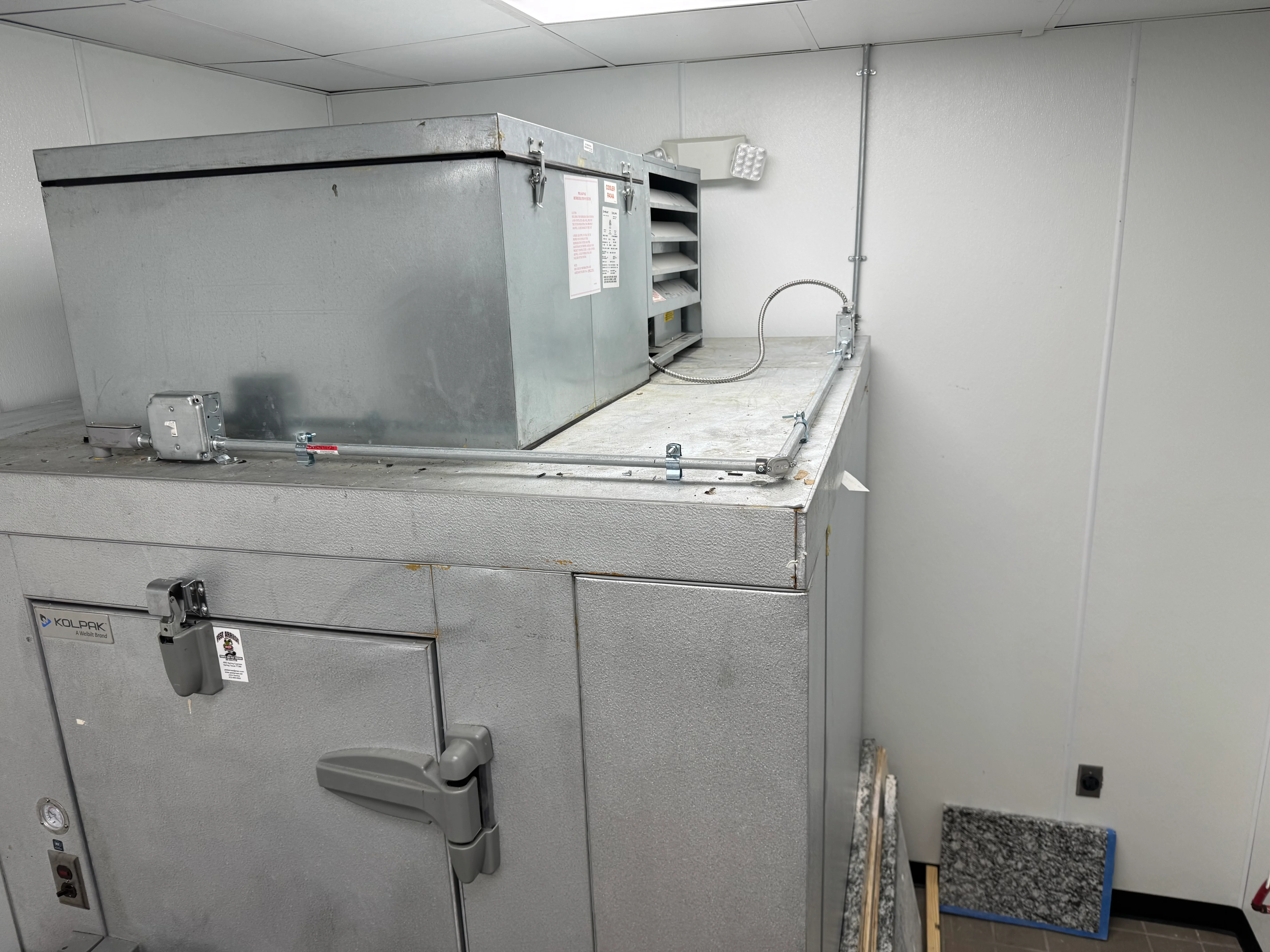 Stainless steel commercial kitchen hood and ventilation system installation in progress